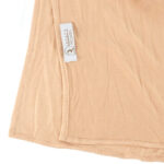 Neatly folded camel premium jersey hijab on a flat surface, displaying its rich tan color and medium-weight fabric.