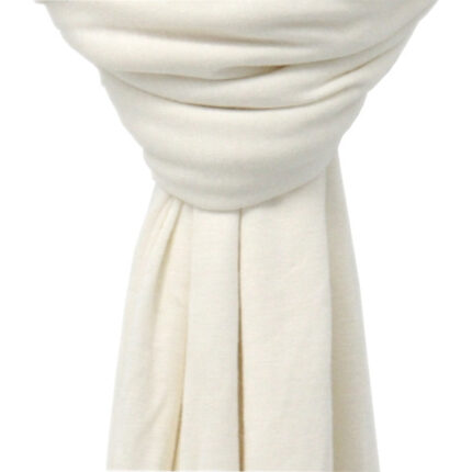 Close-up of the ultra-soft, stretchable cream white premium jersey hijab fabric showing its breathable and thick, non-transparent texture.