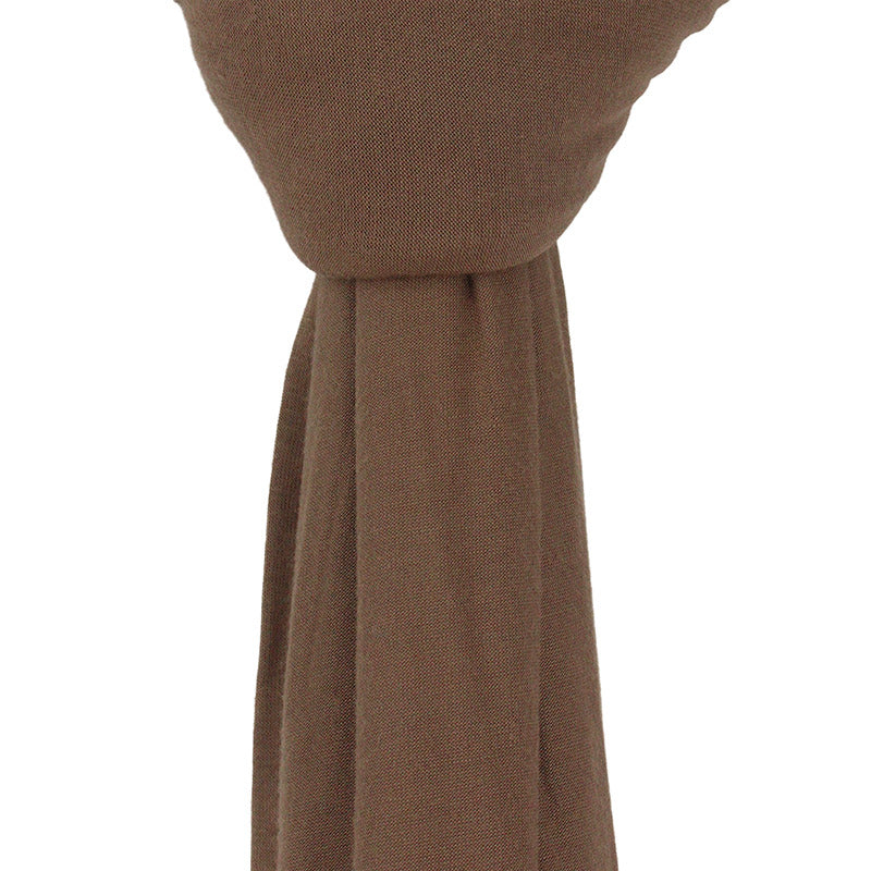 Close-up of the ultra-soft, stretchable dark mocha premium jersey hijab fabric, highlighting its breathable and thick, non-transparent texture.
