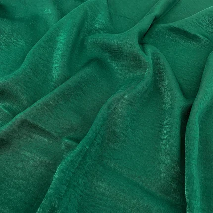 Emerald green velvet satin hijab with a soft, light-catching sheen