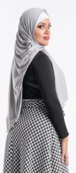 Side profile of a woman wearing the mystic grey premium jersey hijab, highlighting the comfortable, pin-free stretch fit.