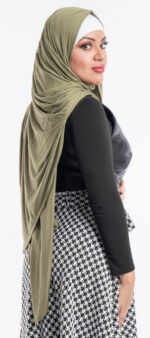 Side profile of a woman wearing the olive green premium jersey hijab, highlighting the comfortable, pin-free stretch fit.