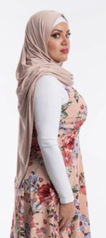 Side profile of a woman wearing the pebble premium jersey hijab, highlighting the comfortable, pin-free stretch fit.