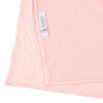 Neatly folded pink premium jersey hijab on a flat surface, showcasing its vibrant pink color and medium-weight fabric.