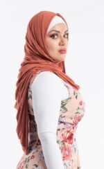 Side profile of a woman wearing the sienna premium jersey hijab, highlighting the comfortable, pin-free stretch fit.