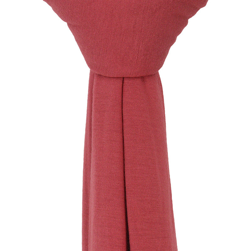 Close-up of the ultra-soft, stretchable watermelon premium jersey hijab fabric showing its breathable and thick, non-transparent texture.